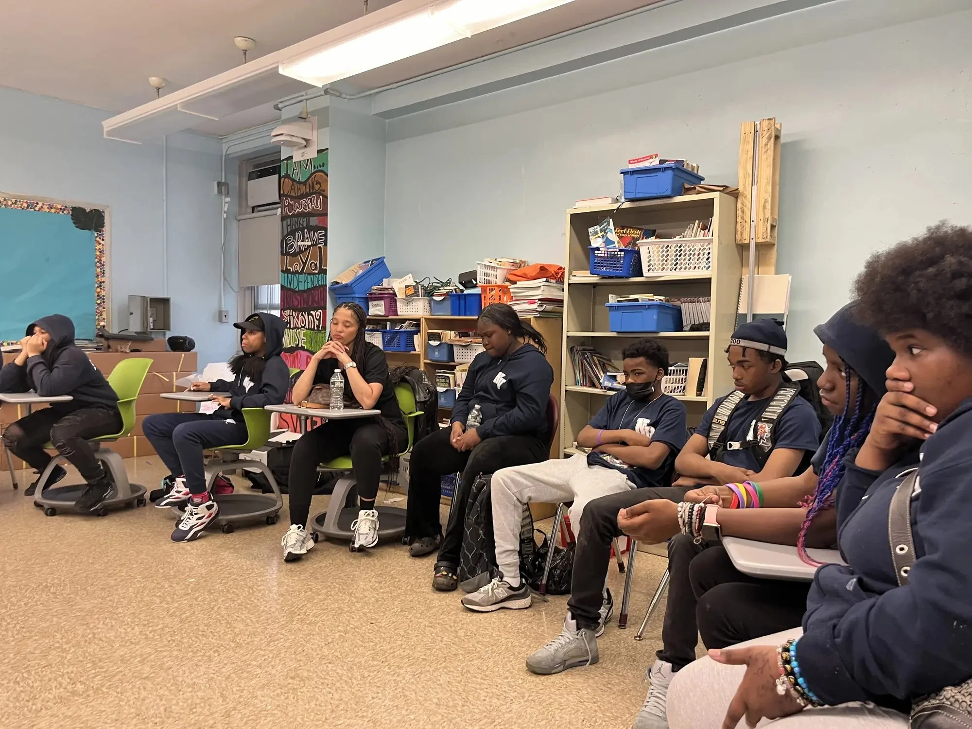 Young people taking part in a classroom discussion