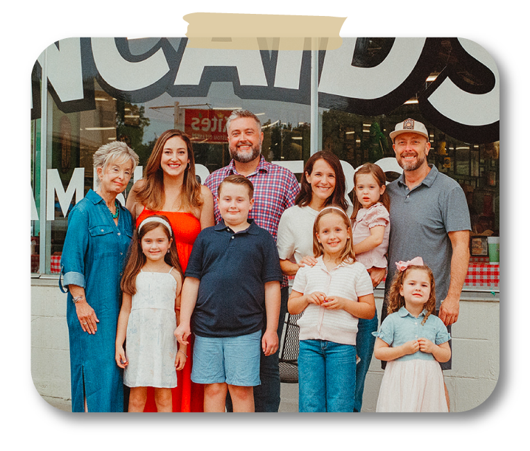 The Gentry family gathered in front of their restaurant.