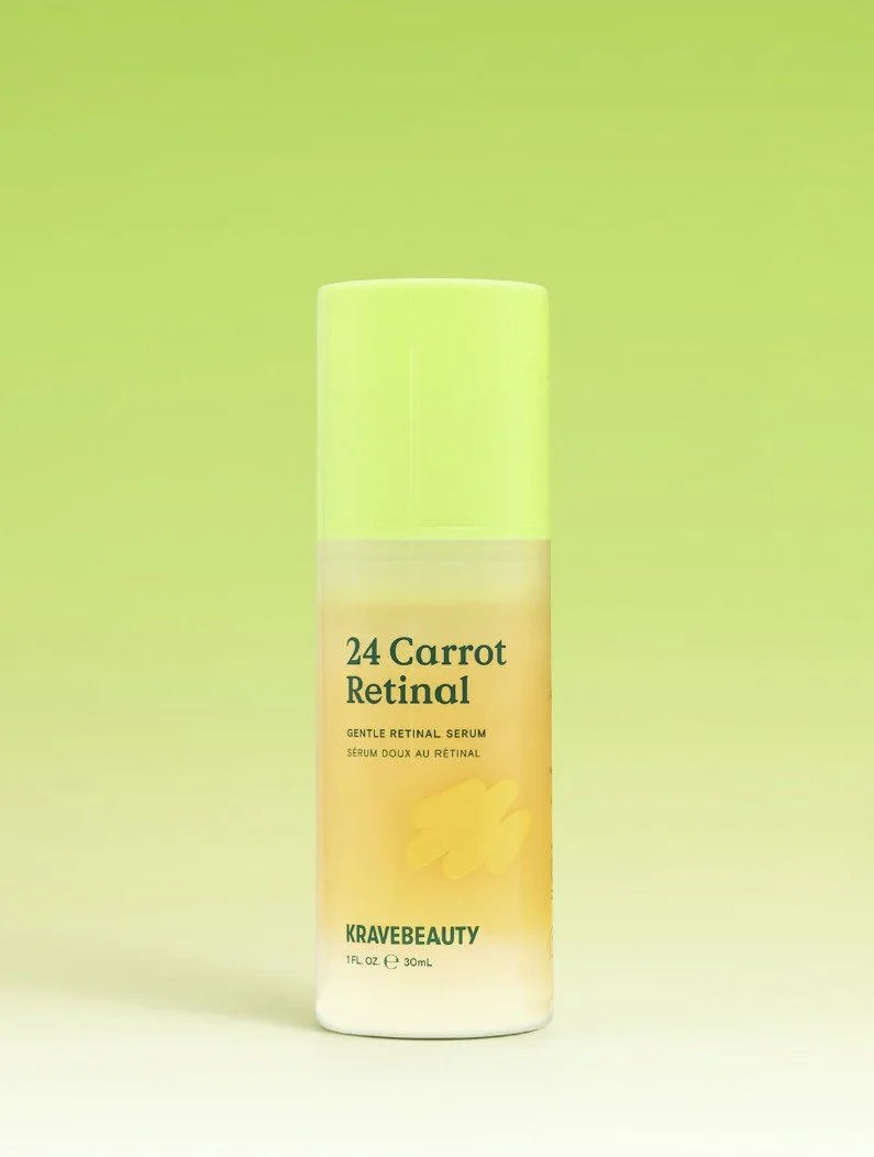 A bottle of KraveBeauty 24 Carrot Retinal gentle retinol serum with a green cap, set against a gradient green and yellow background.