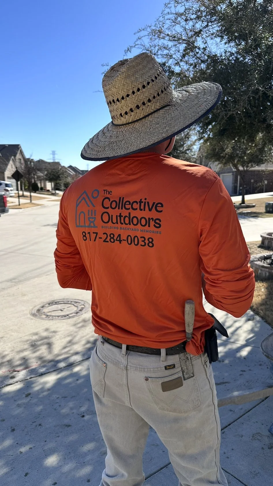 TCO team member on site wearing a Building Backyard Memories shirt in Fort Worth