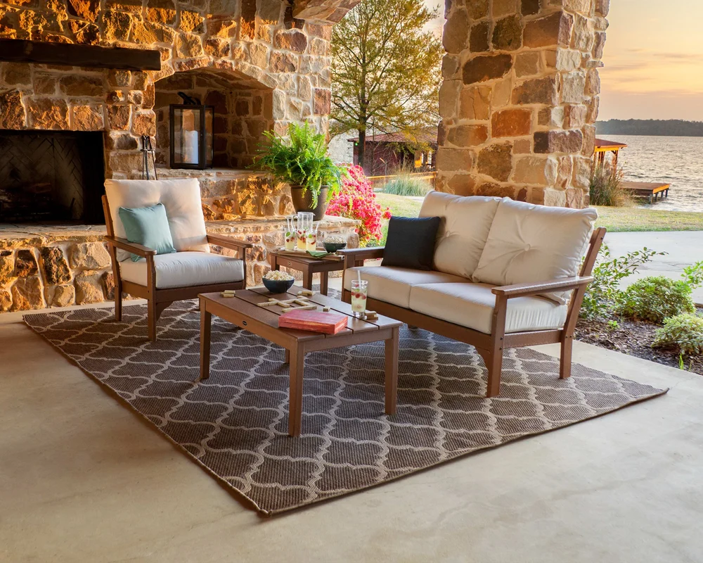 POLYWOOD Vineyard cushioned deep-seating loveseat and lounge chair on a covered patio