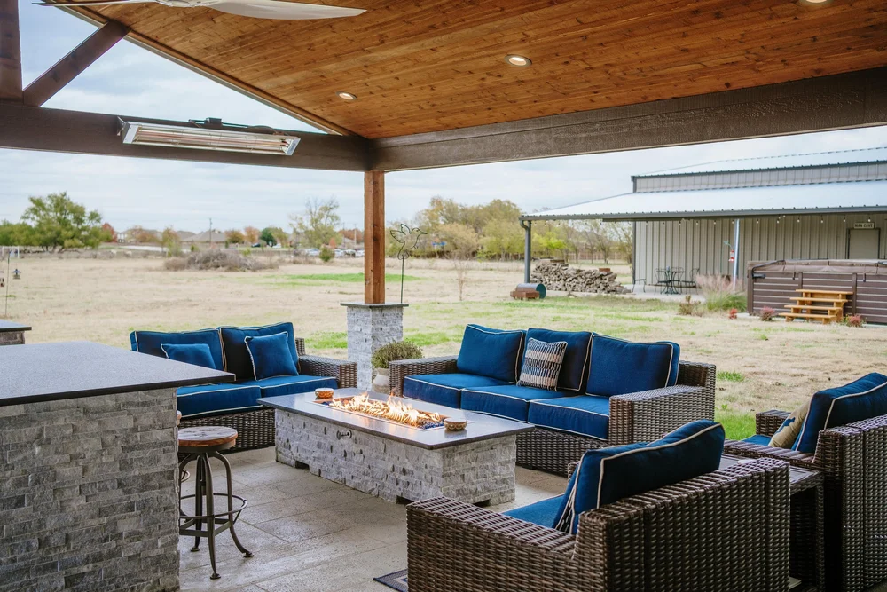 TCO covered outdoor living project with lounge seating and a fire table in Haslet, Texas