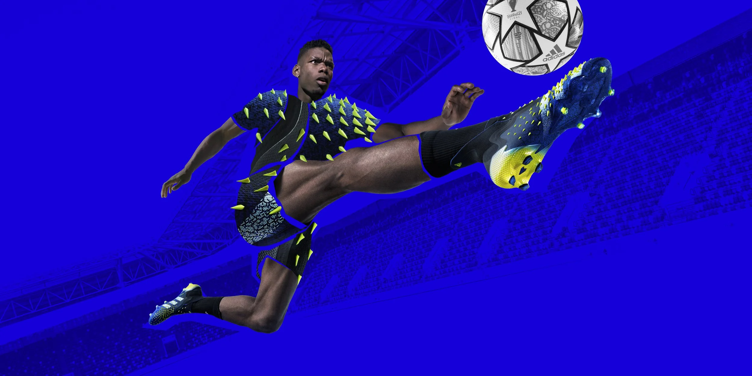 A soccer player in athletic gear performing a mid-air kick with a soccer ball in mid-flight against a stadium background