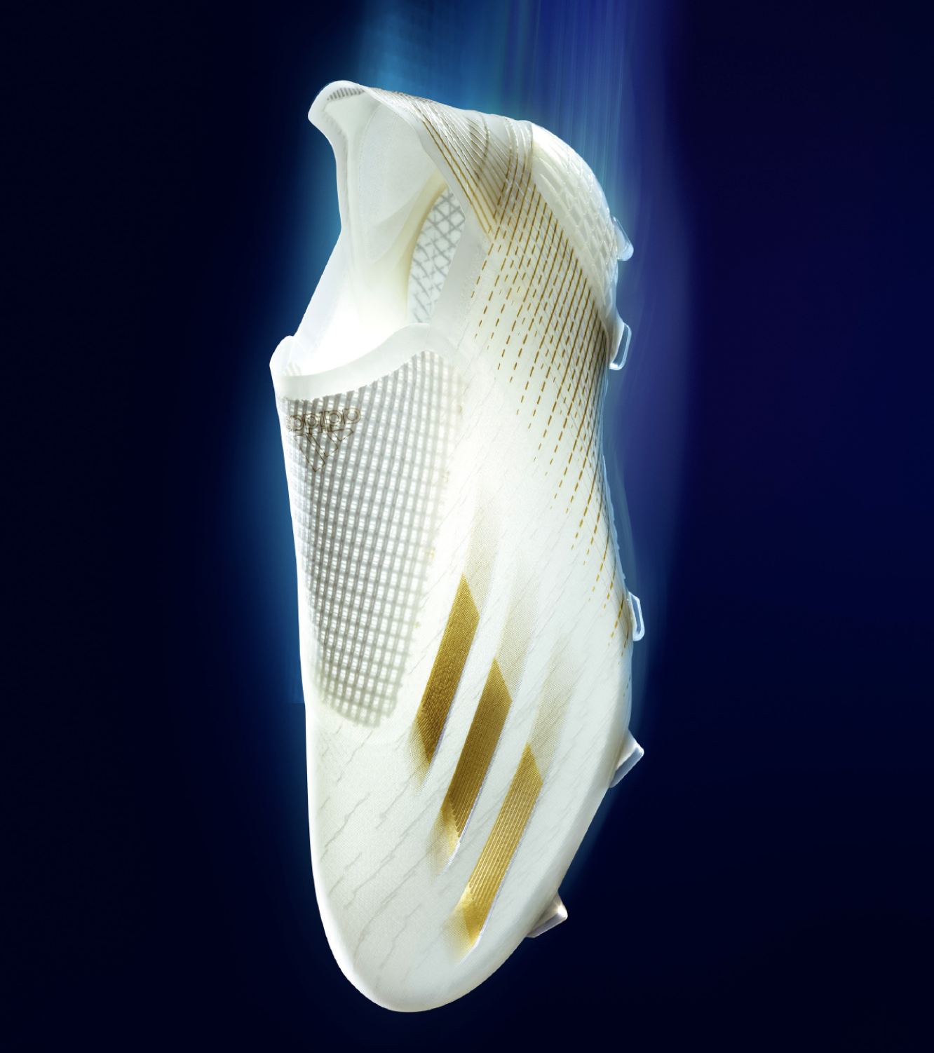 A close-up of a modern, white and gold athletic shoe viewed from the side against a dark background, highlighting its sleek design and details.