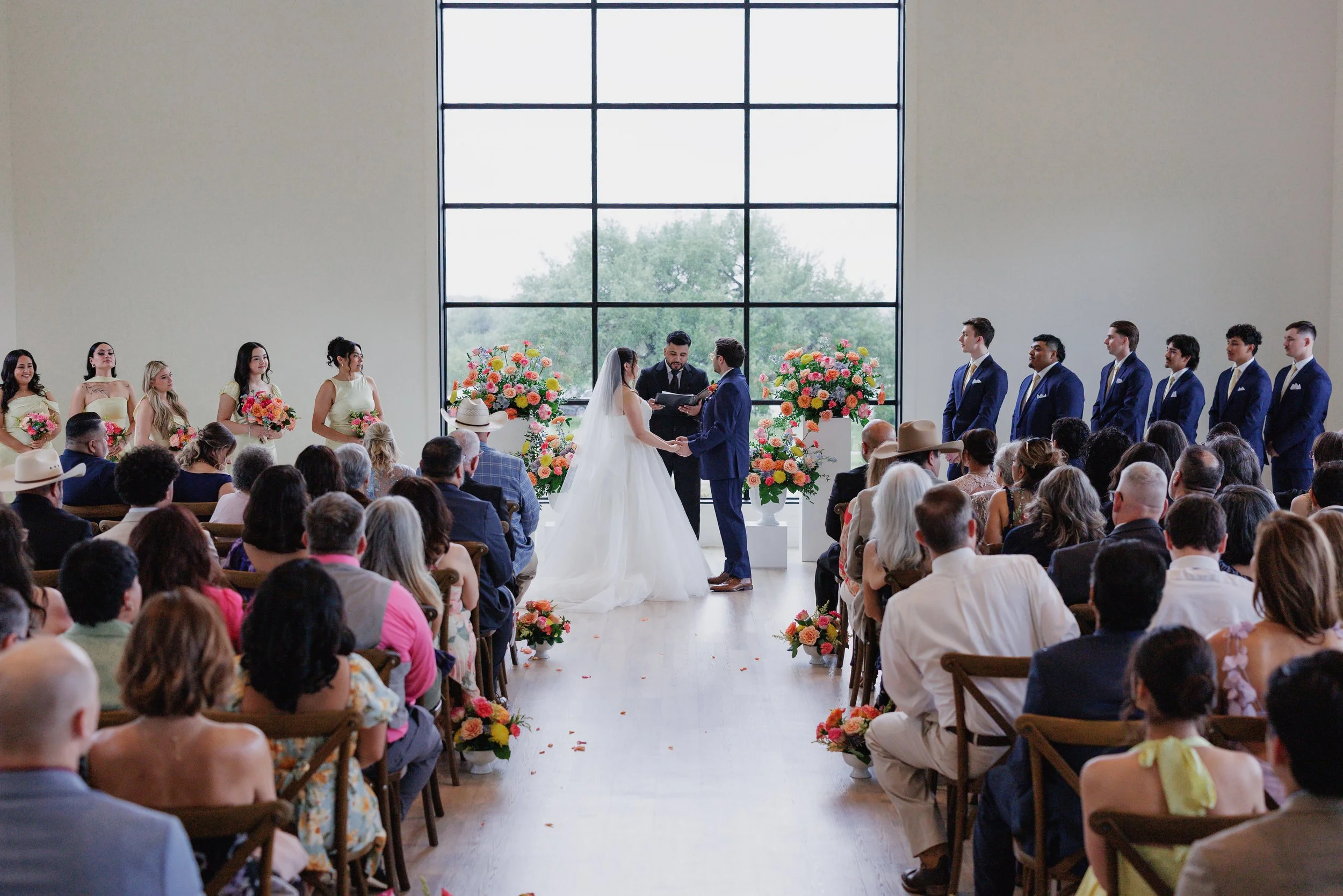 Pulled back wide angle photo of the wedding ceremony at the Arlo, in Austin Texas shot by Dallas Gannon Photography