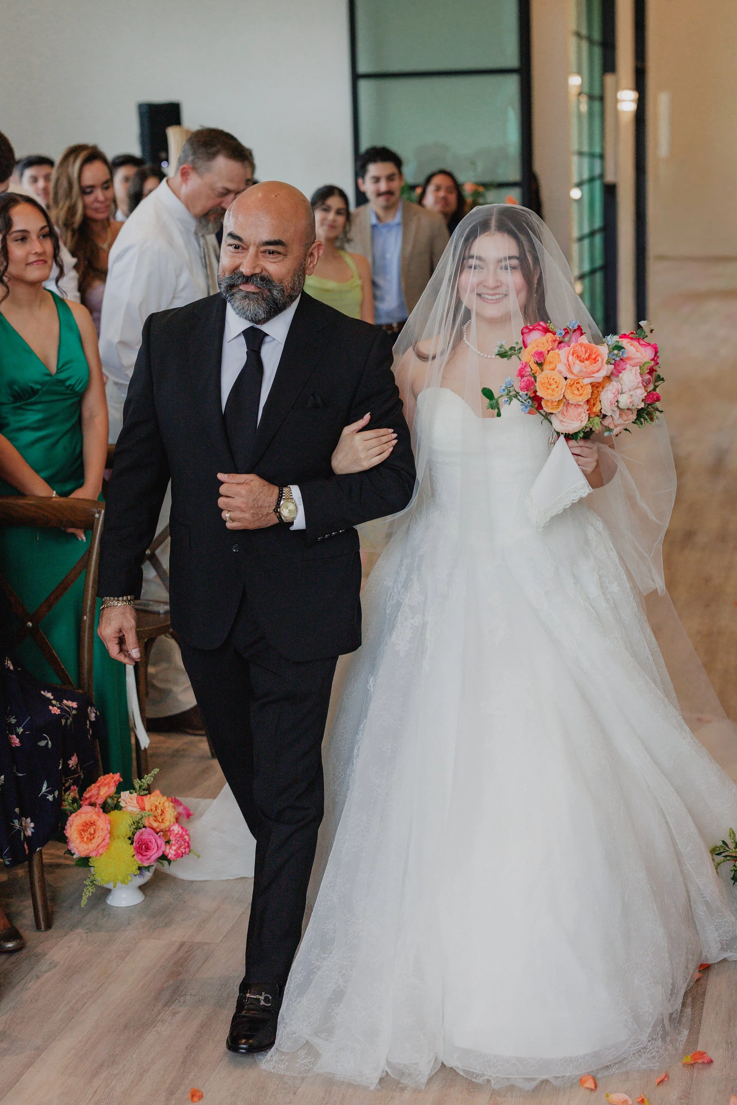 Father walks the bride down the isle during her wedding ceremony at the Arlo In Austin Texas