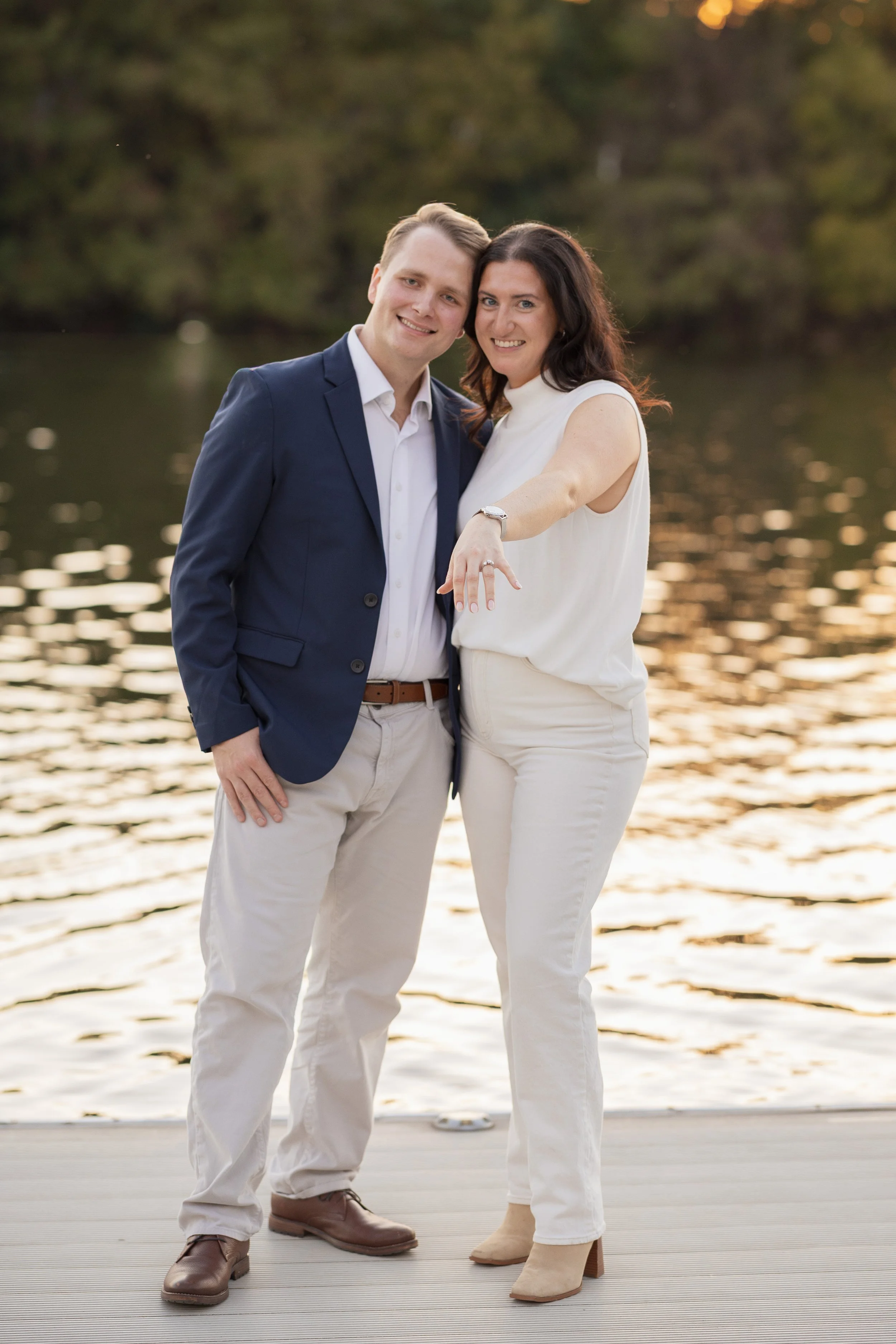 Engagement photos of the couple showing off the ring in downtown Austin Texas