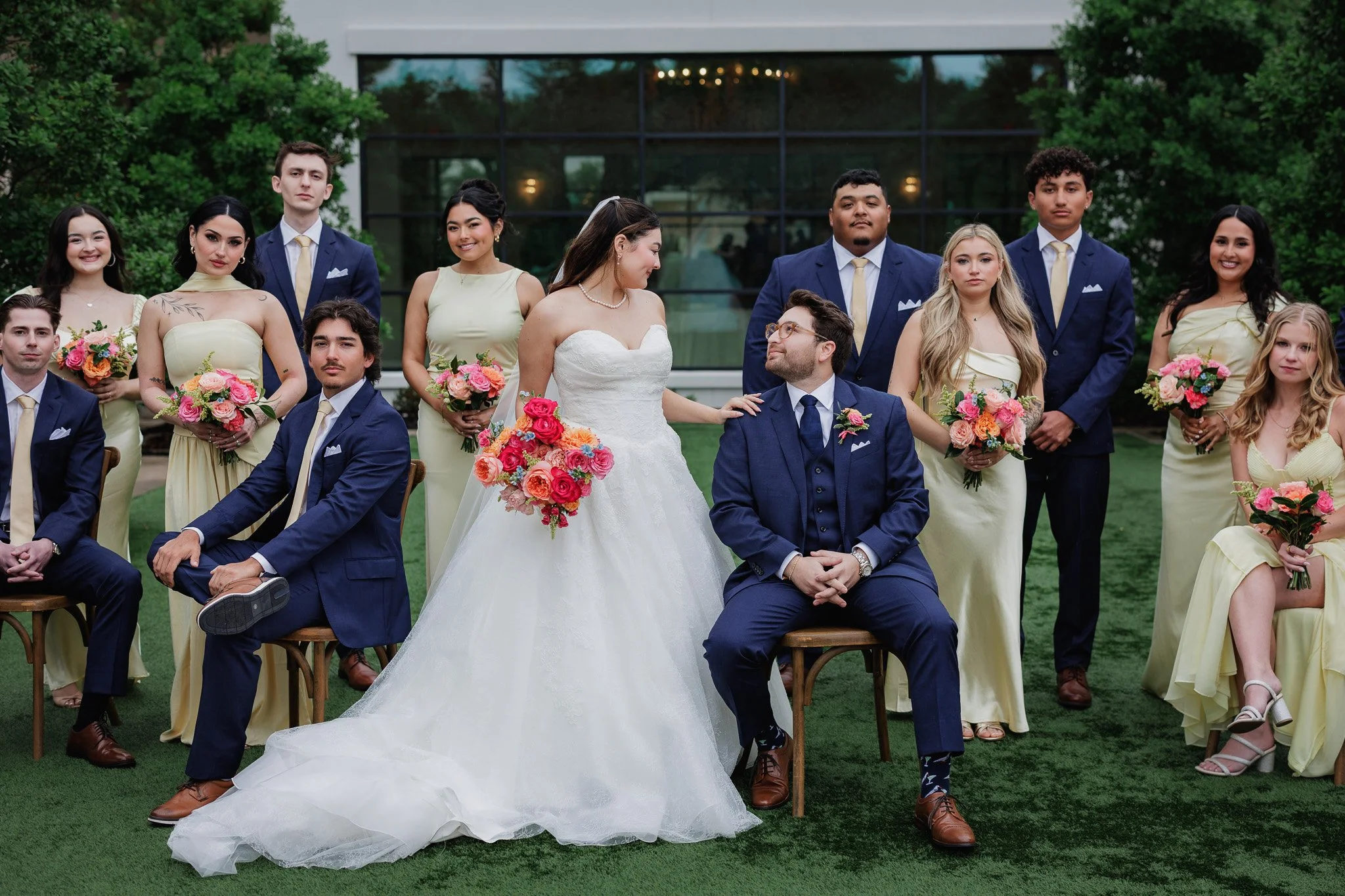 Posed editorial expensive looking bridal party group photos outside the Arlo Wedding Venue venue in Dripping Springs, Texas