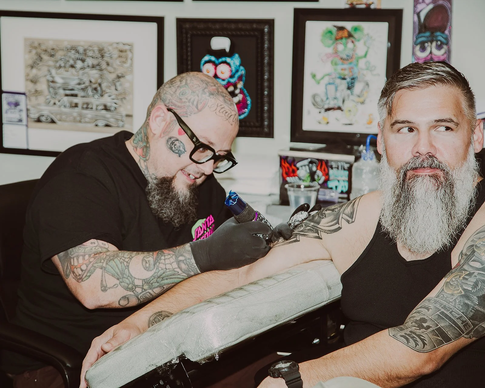 Close-up of a tattoo artist at work on a client at Ink & Iron Tattoo in Midlothian, VA. Done by Fairy Bread Photo