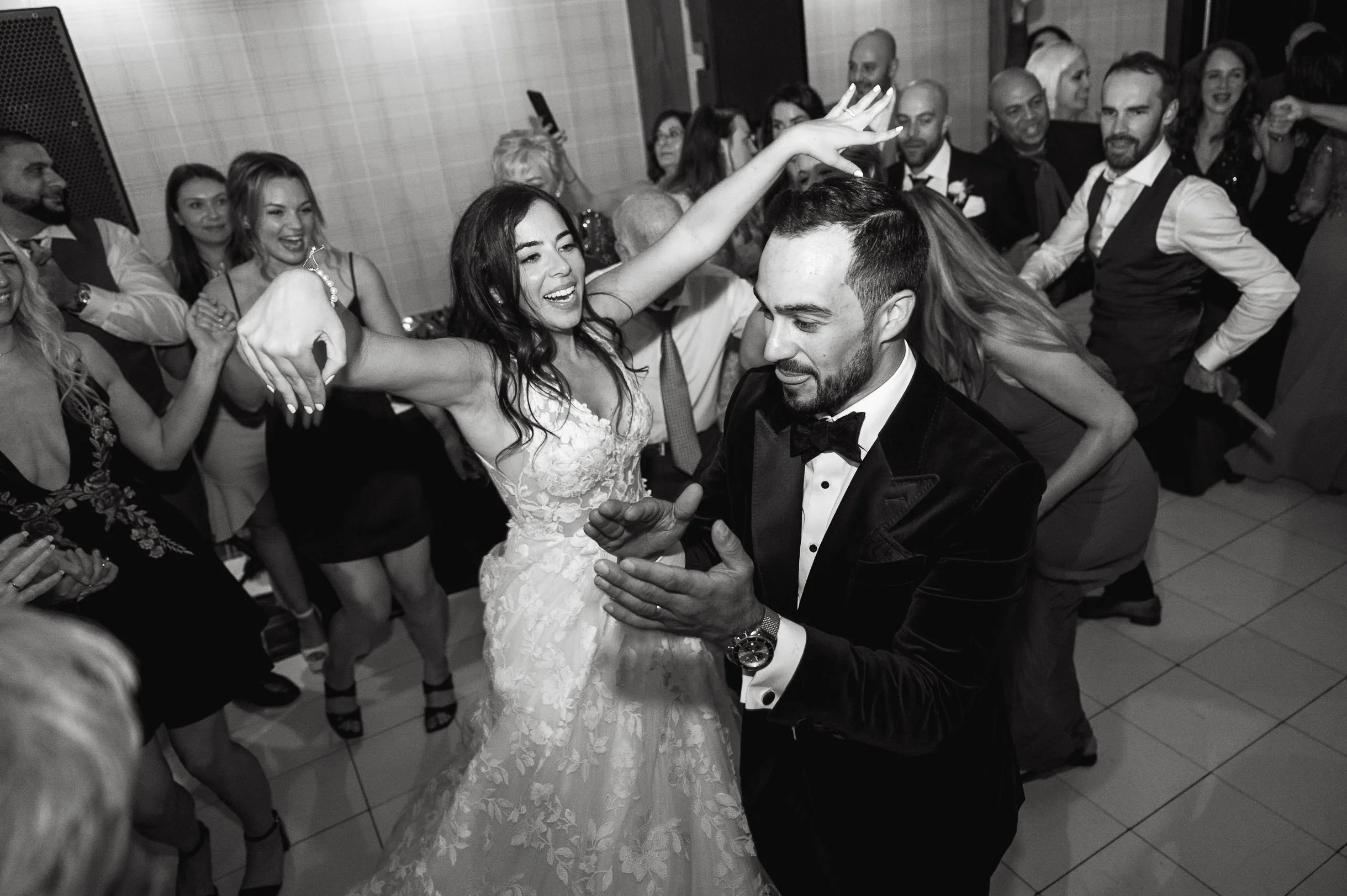 Bride and groom party on dancefloor with their wedding guests at Bearspaw Golf Course