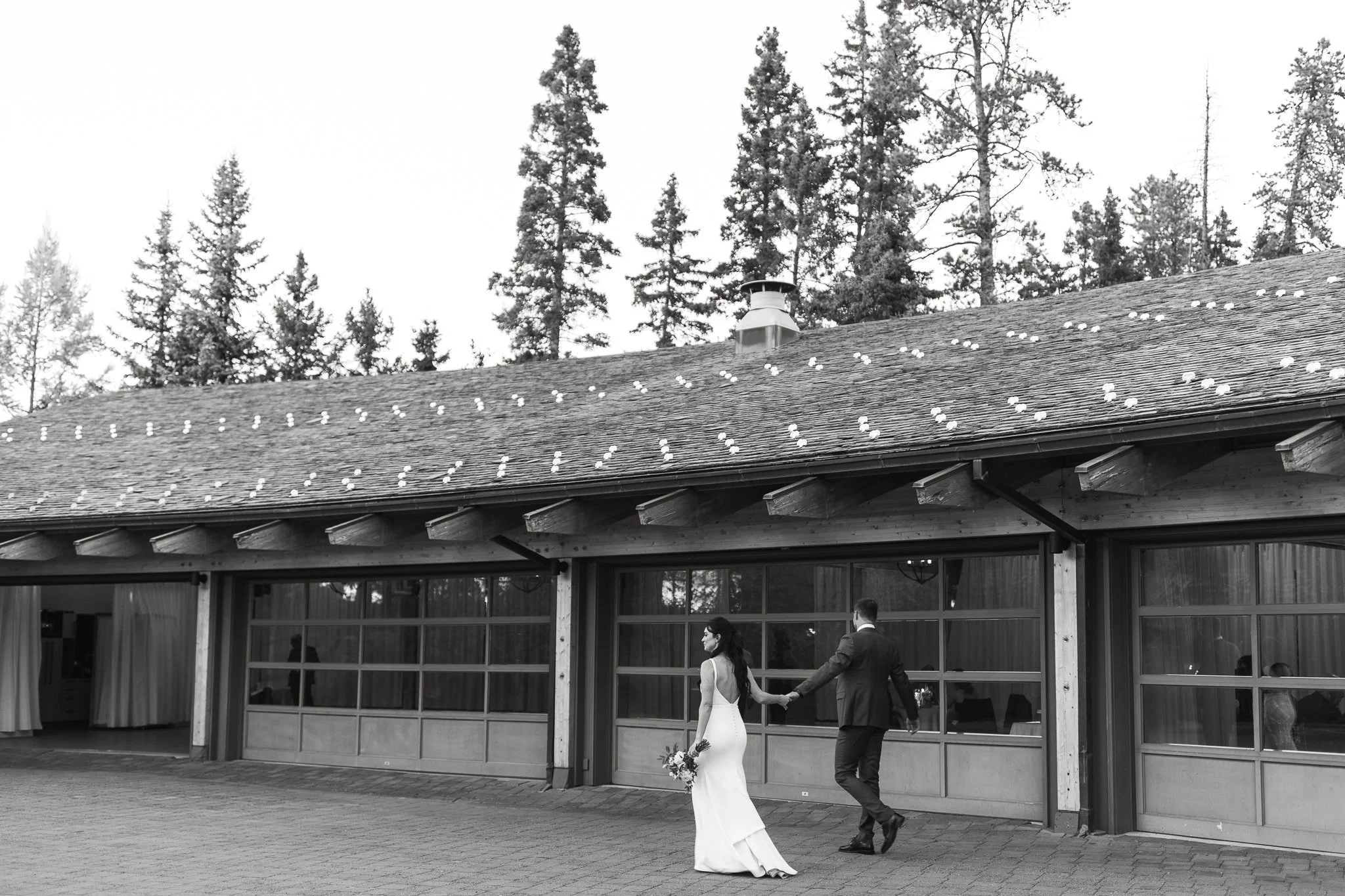Bride and groom walk into their wedding ceremony at Azuridge Hotel wedding venue outside of Calgary, Alberta