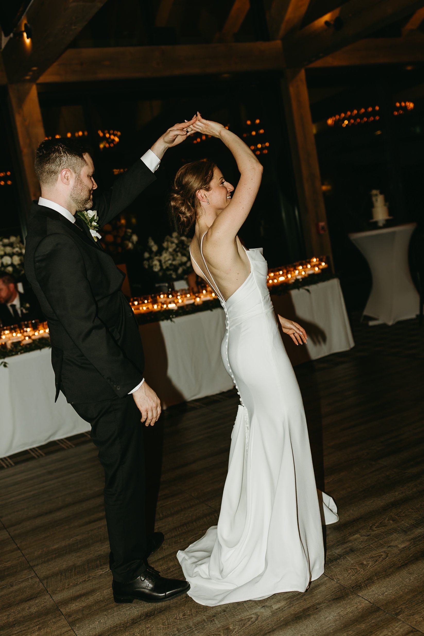 Bride and groom first dance during their wedding at Bearspaw Golf Course in Calgary 