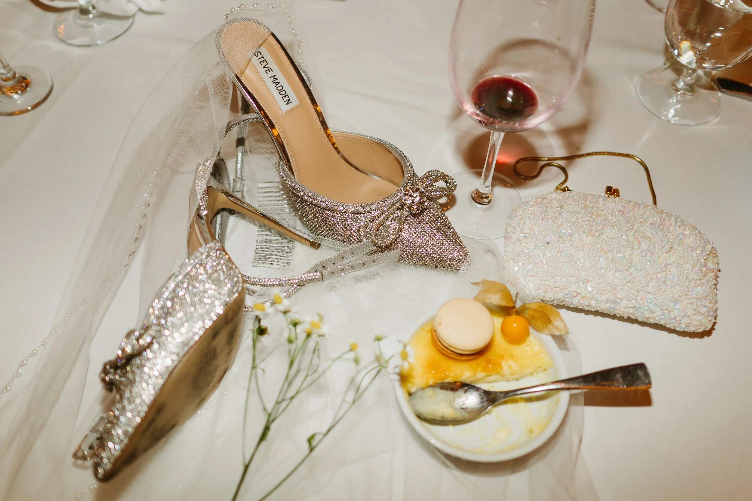 Messy wedding detail photo of sequin embellished shoes at the end of the wedding night at Silvertip Resort in Camore