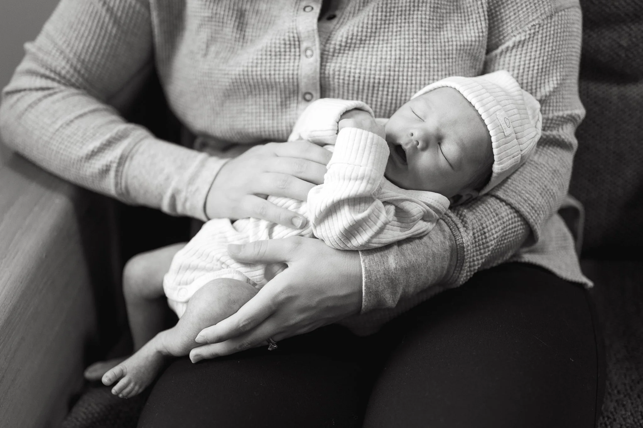 Black and white photo of newborn baby at home newborn session in Calgary 