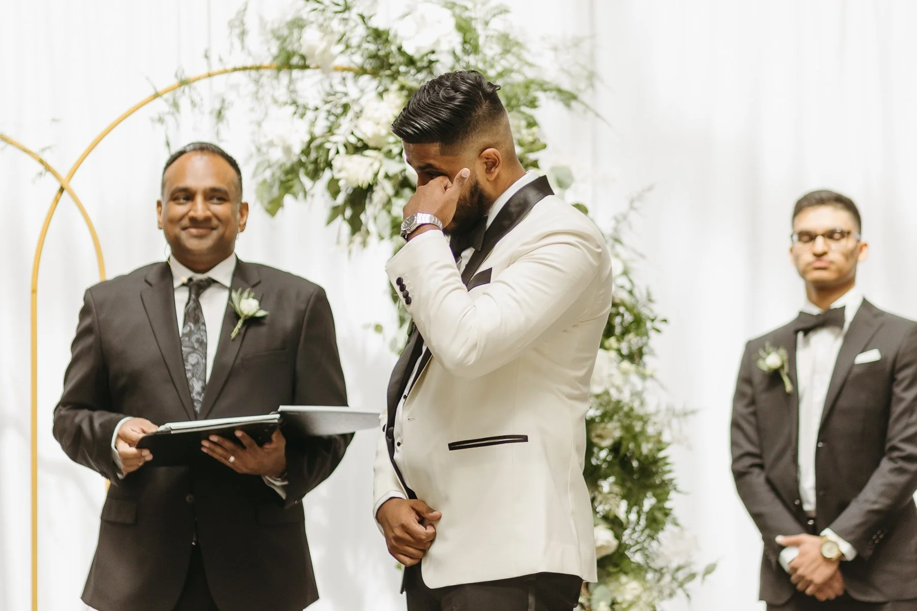 Groom crying during ceremony 