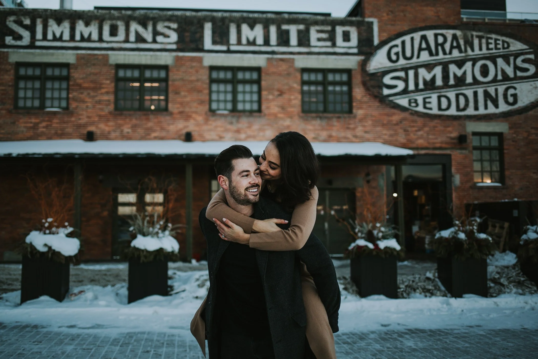 Calgary engagement photos in front of the Simmons Building