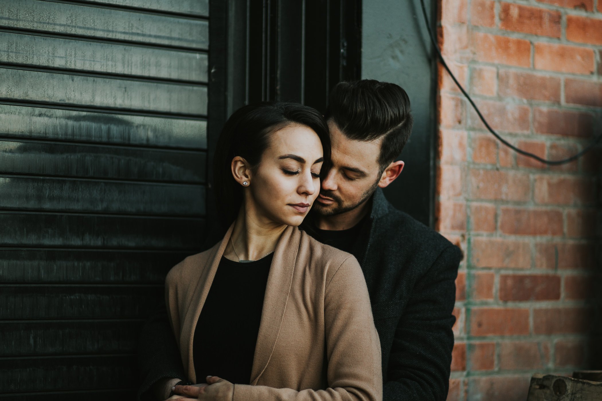 Moody engagement photos in Calgary's East Village