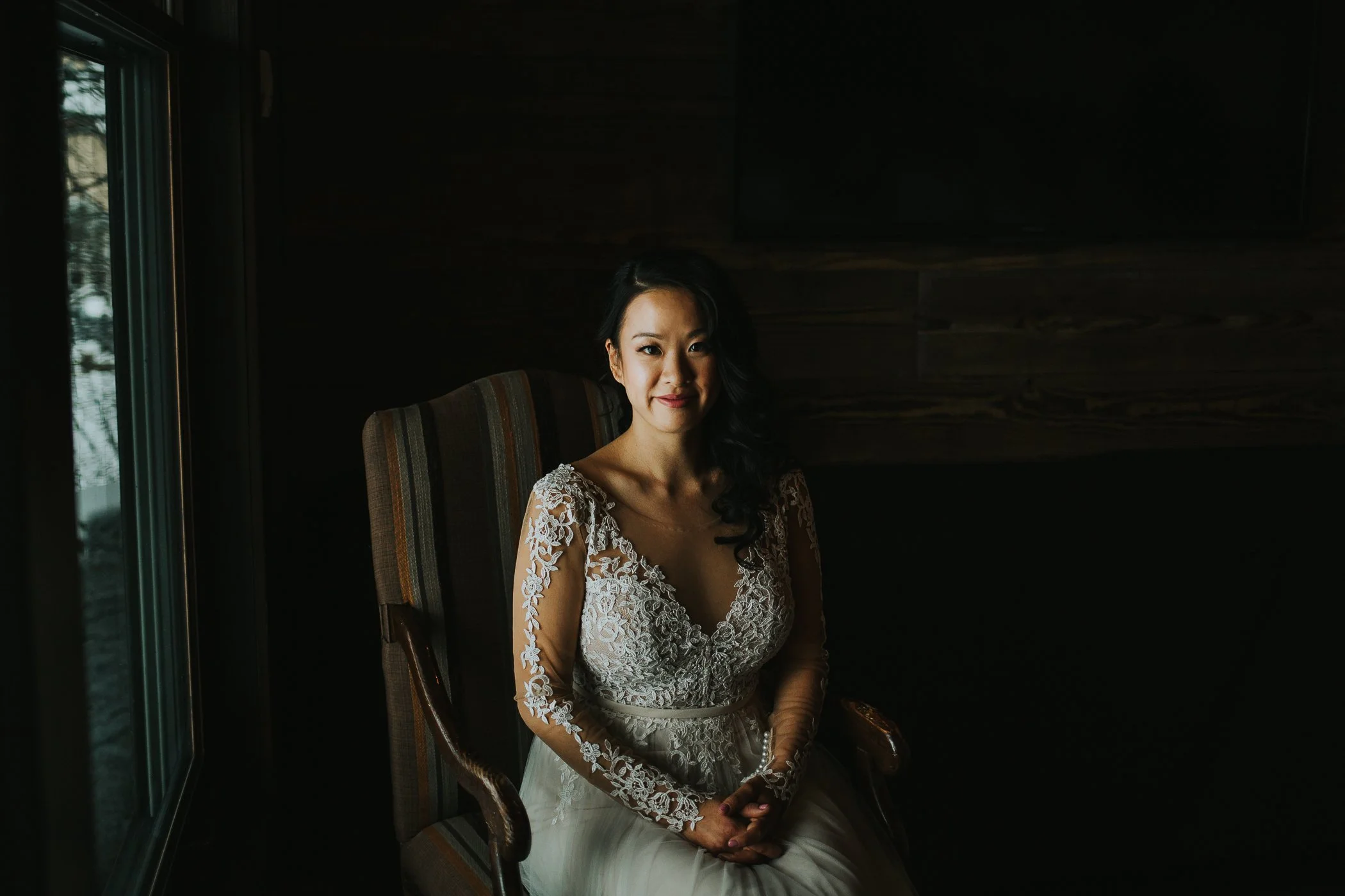 Calgary Alberta winter wedding moody bridal portrait lace sleeve dress