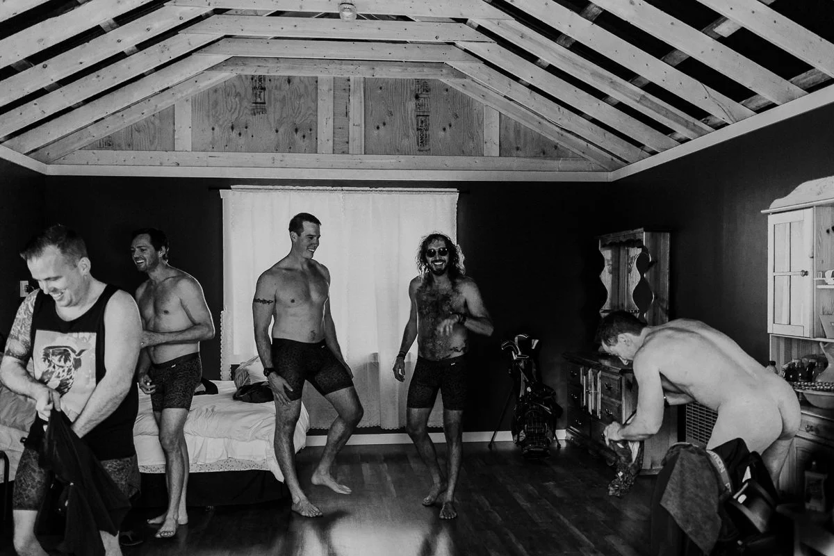 Groomsmen getting dressed Shylynn Ranch wedding cabin