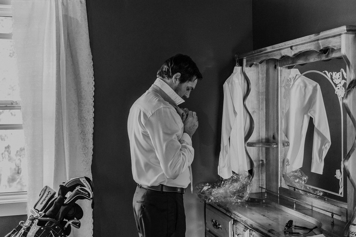 Groom getting ready Shylynn Ranch wedding 