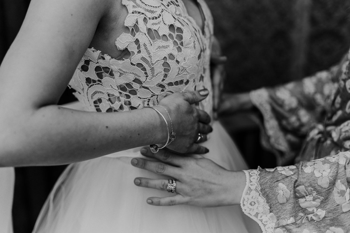 Bride getting ready lace Blush by Hailey Paige wedding dress
