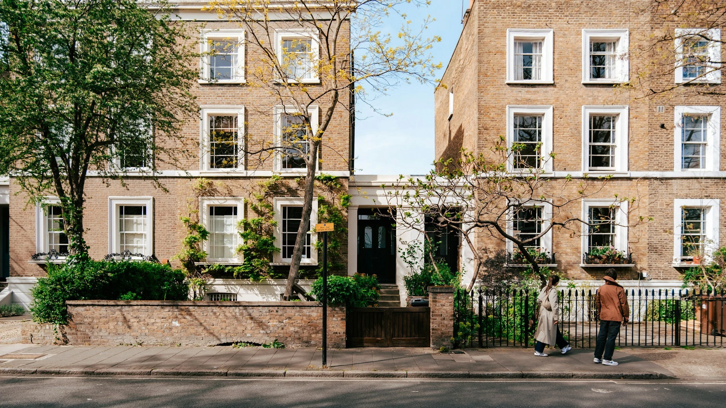 Well-maintained London residential block with flower boxes and street-level landscaping