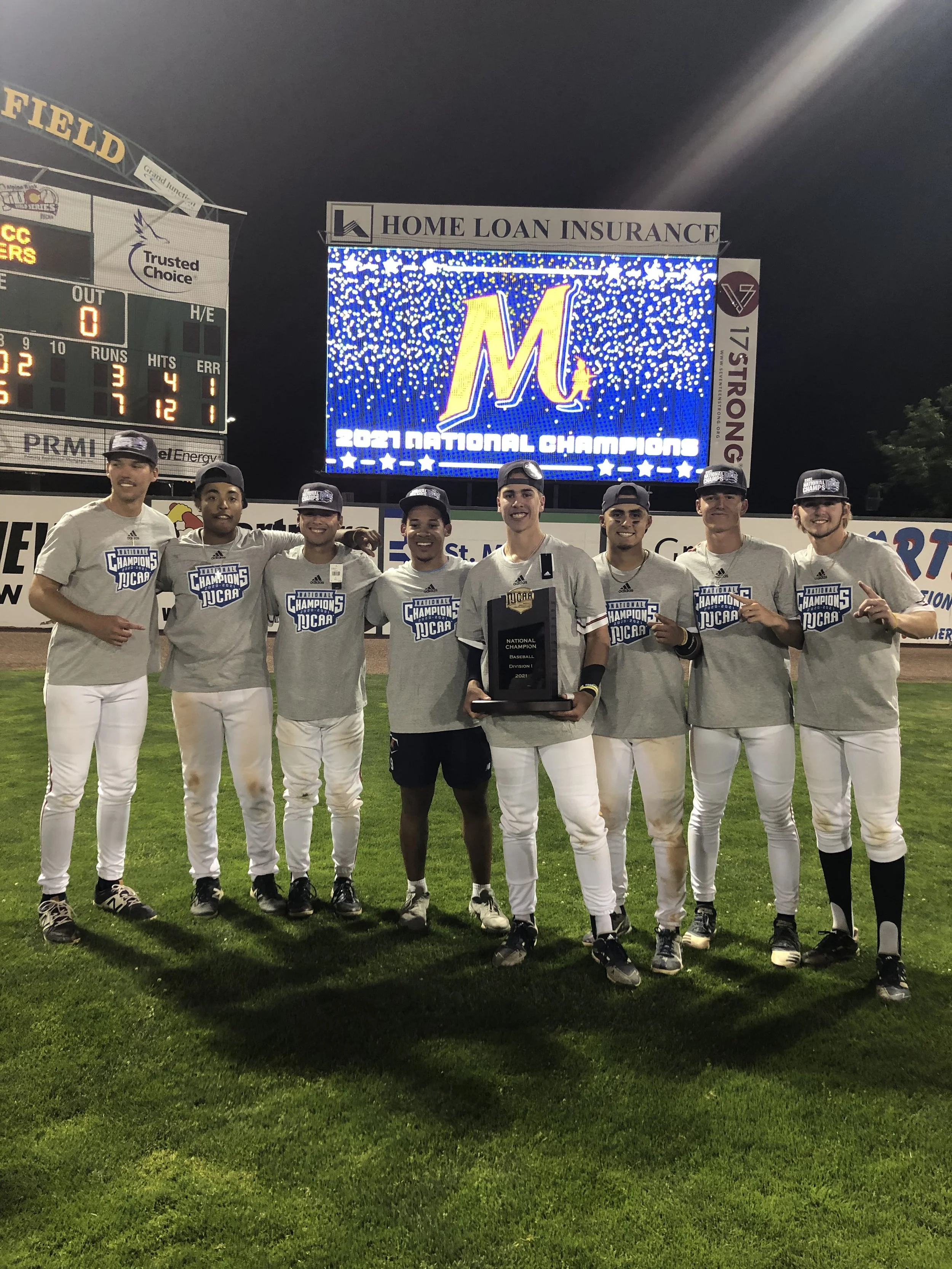 Hank Bard celebrating the 2021 NJCAA national championship with McLennan Community College