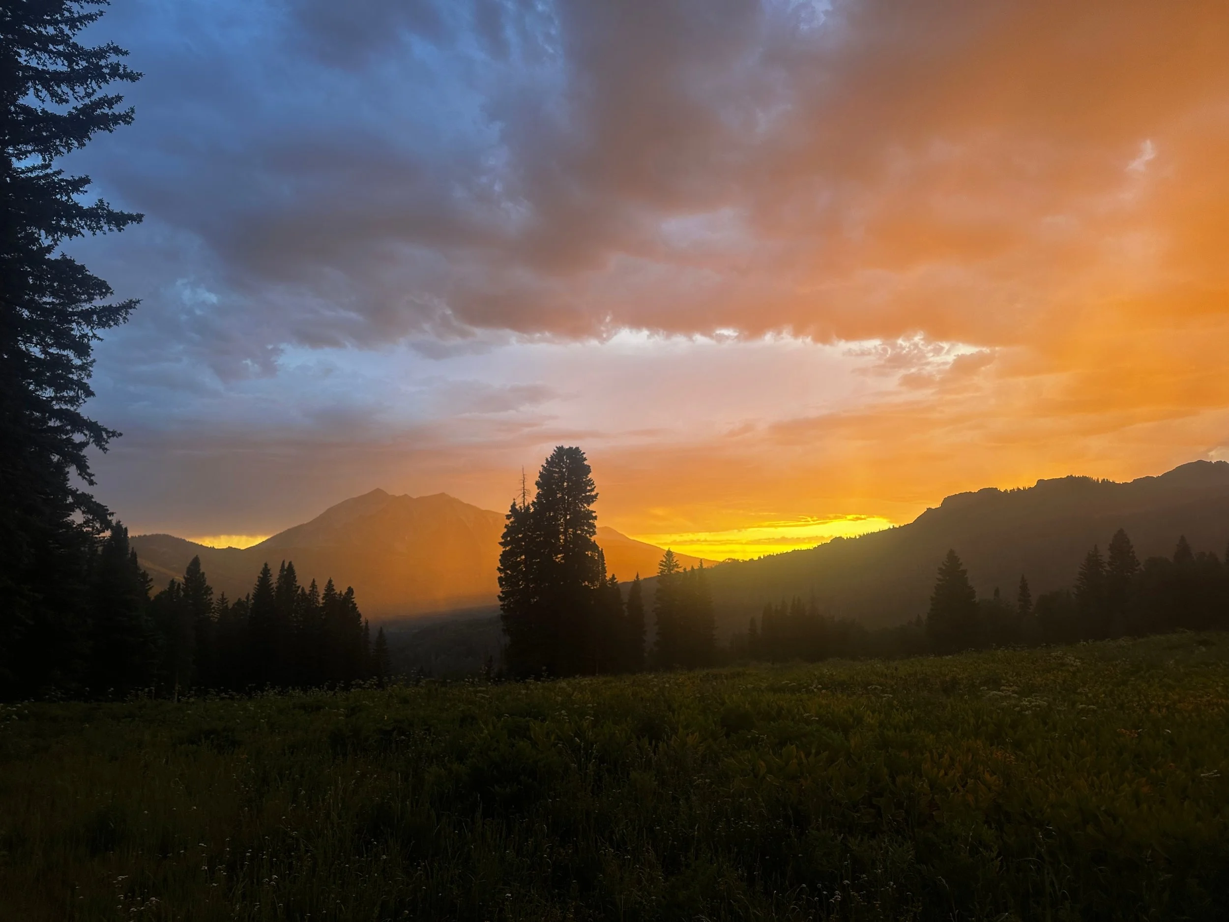 Sunset over the Beckwith Mountains in Crested Butte, representing our second-home care, local expertise, and personalized adventure concierge services