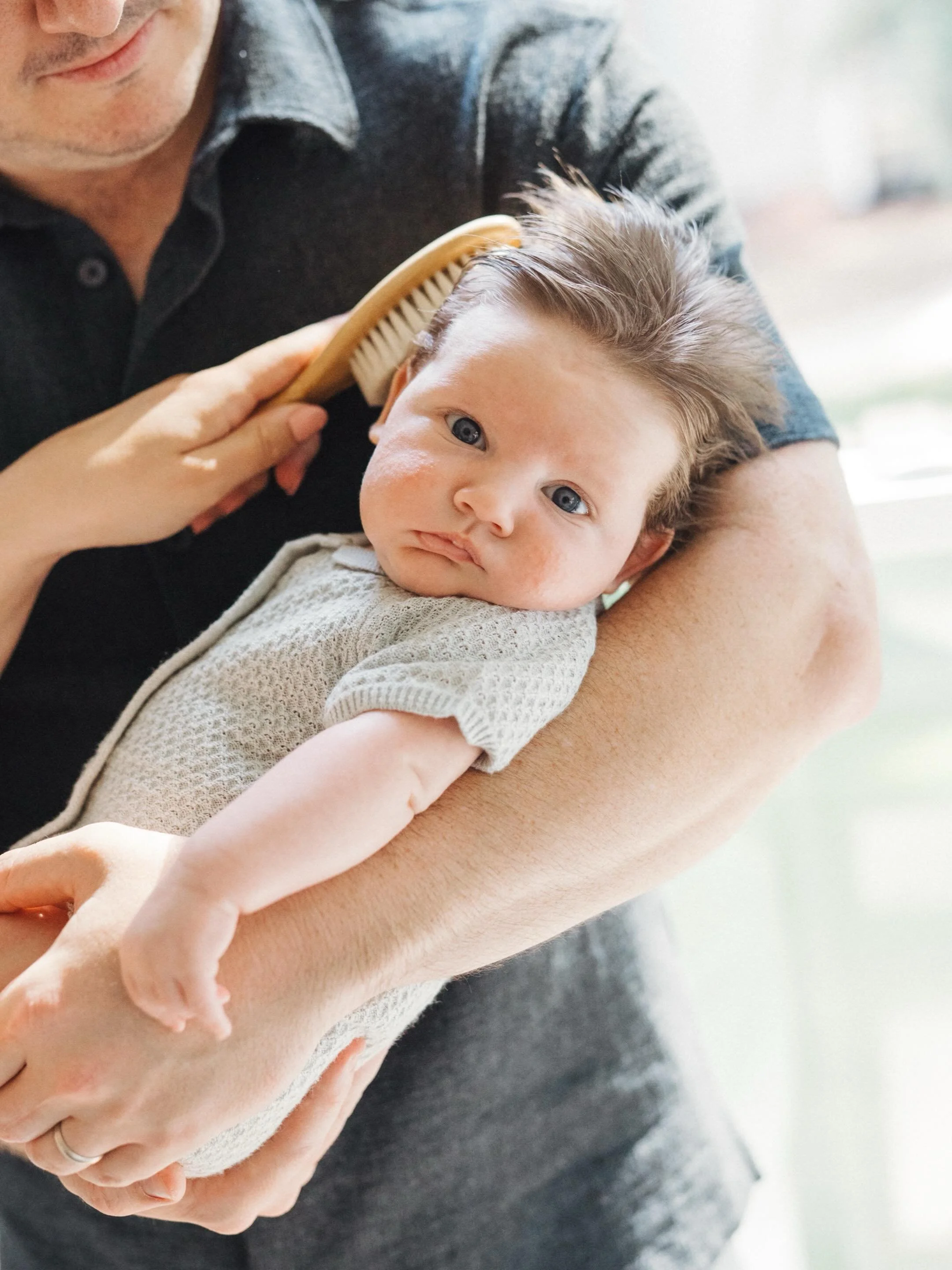There is something sacred about walking into newborn sessions with new parents - it holds and purity and slowness that I love leaning into as we move through our time together. 

I think we all envision what these sessions will look like but rarely k