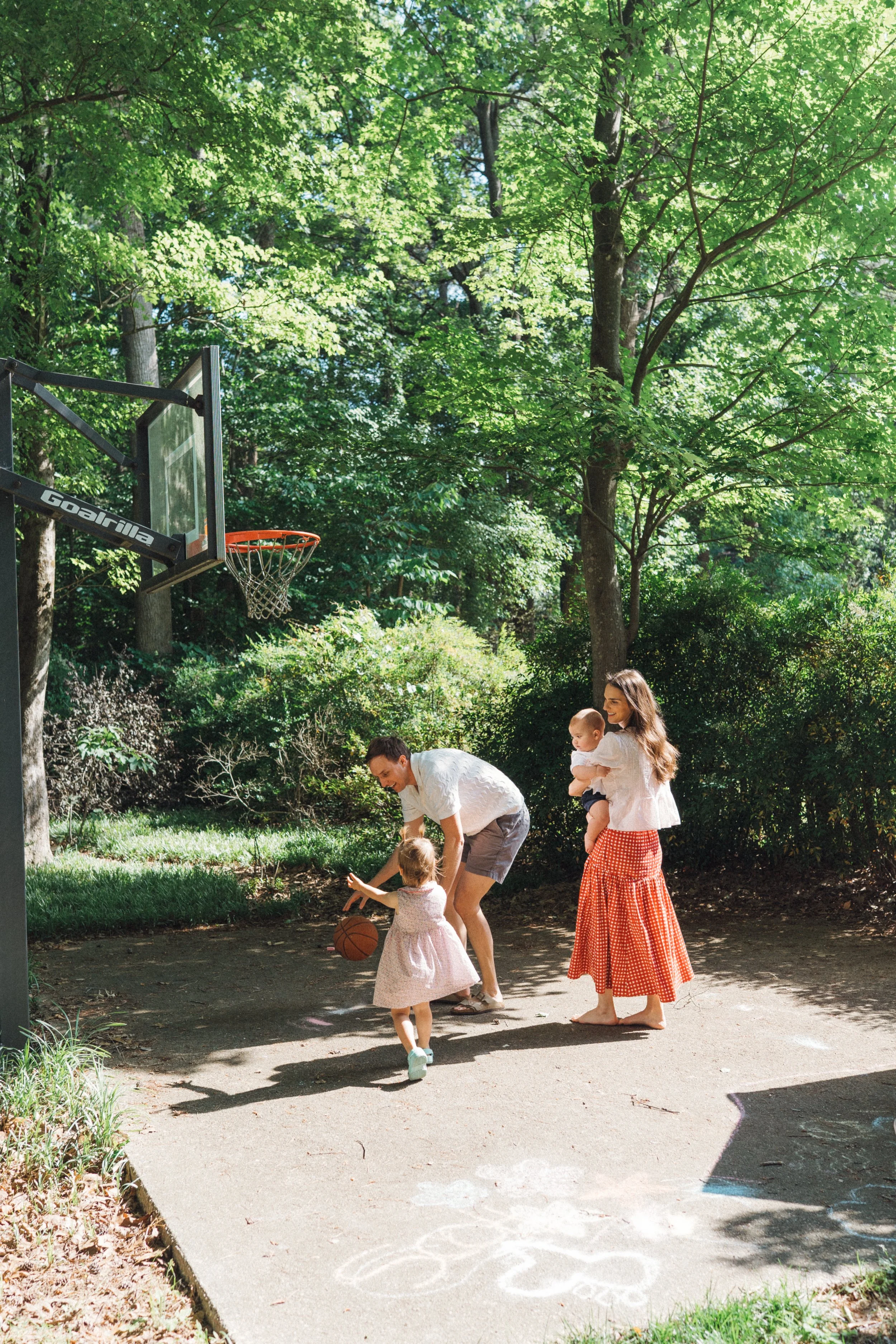 Family with Little Children Playing Basketball in Raleigh, NC Backyard