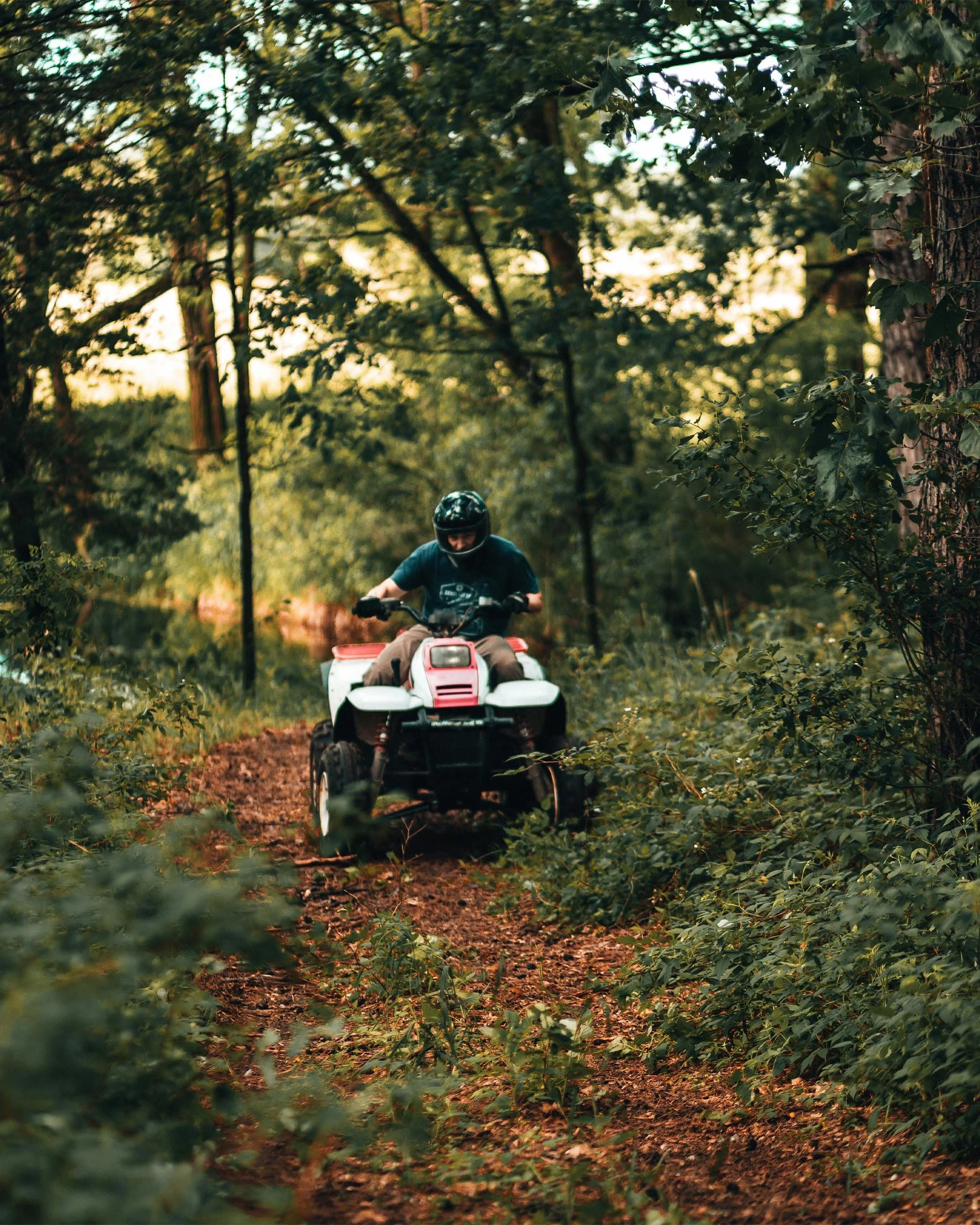 Man on ATV in woods