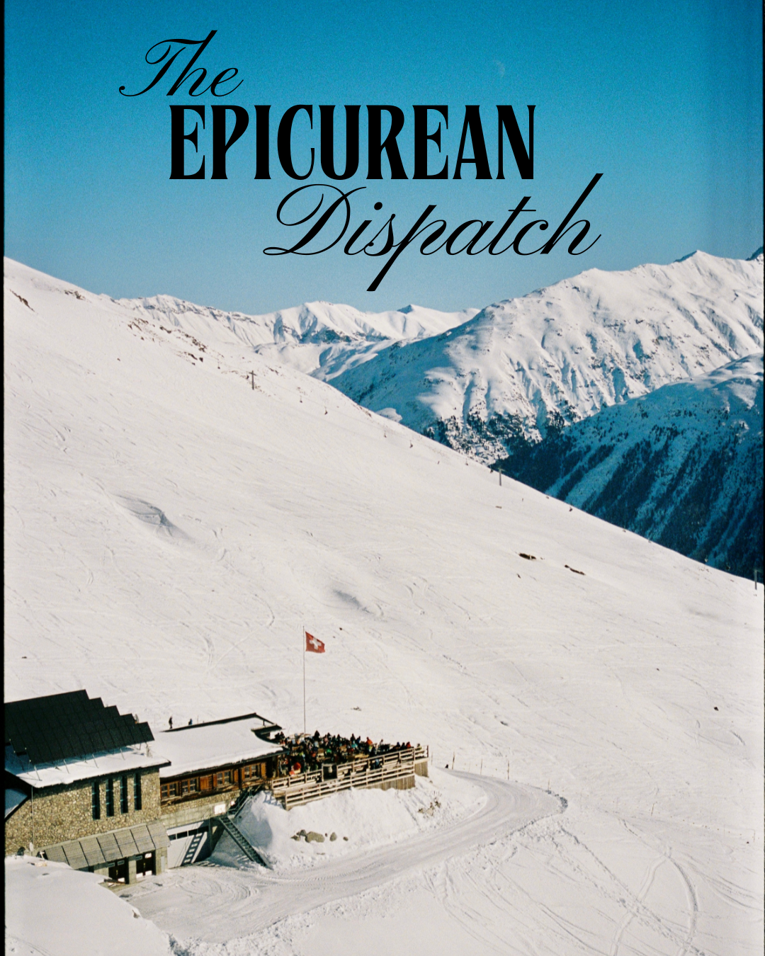 A snow-covered mountain landscape with a building at the bottom and a Swiss flag. The background features rugged, snow-capped peaks under a clear blue sky. The text overlaid on the image reads 'The Epicurean Dispatch'.