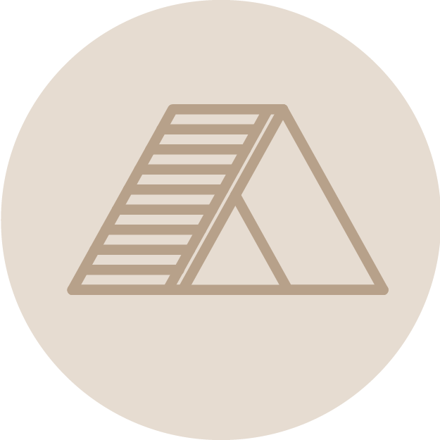 An icon of a dog agility ramp with a sloped surface and a triangular frame.