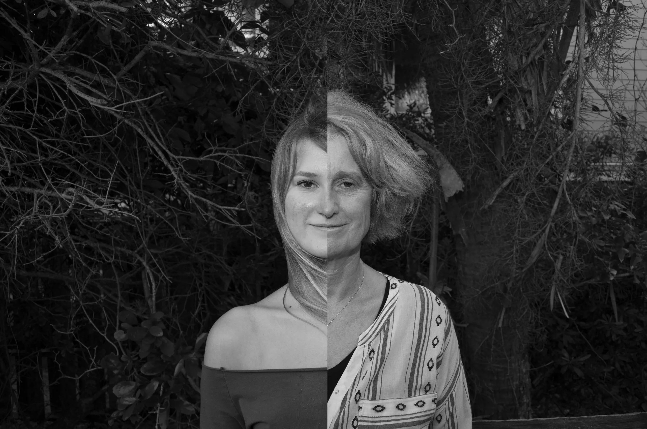 A black and white photo of a woman with half of her face behind a tree on one side and the other half visible, wearing an off-the-shoulder top on the left and a-striped shirt on the right, standing against a background of trees and foliage.