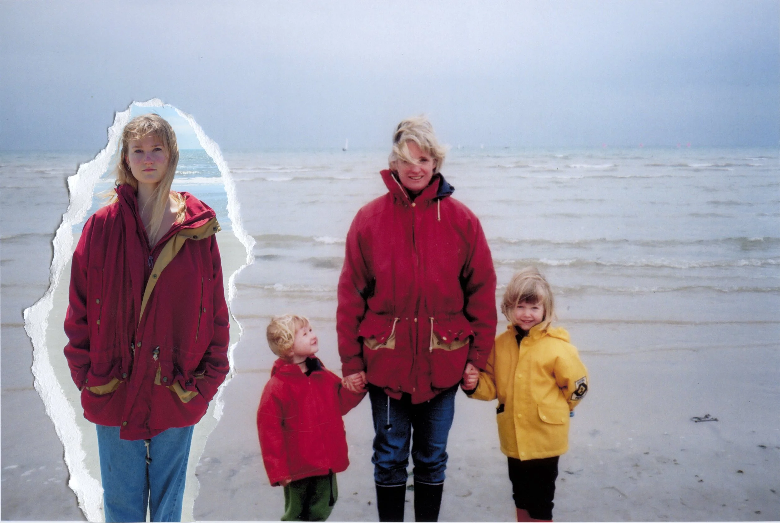 A woman and three children at the beach. The woman and one child are holding hands, and they are dressed in jackets, with the woman wearing a red jacket and the children in red and yellow jackets. One girl is seen in a separate torn section, wearing a red jacket. The background shows the ocean with small waves under an overcast sky.