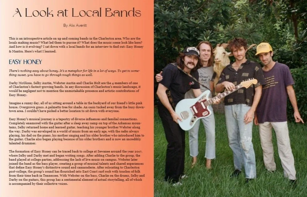 The image features a group of five young men standing outdoors in front of lush green trees, posing for a photo. One of them holds a guitar, and another has a llama perched on his shoulder. They are casually dressed, and the scene appears to be a casual outdoor setting.