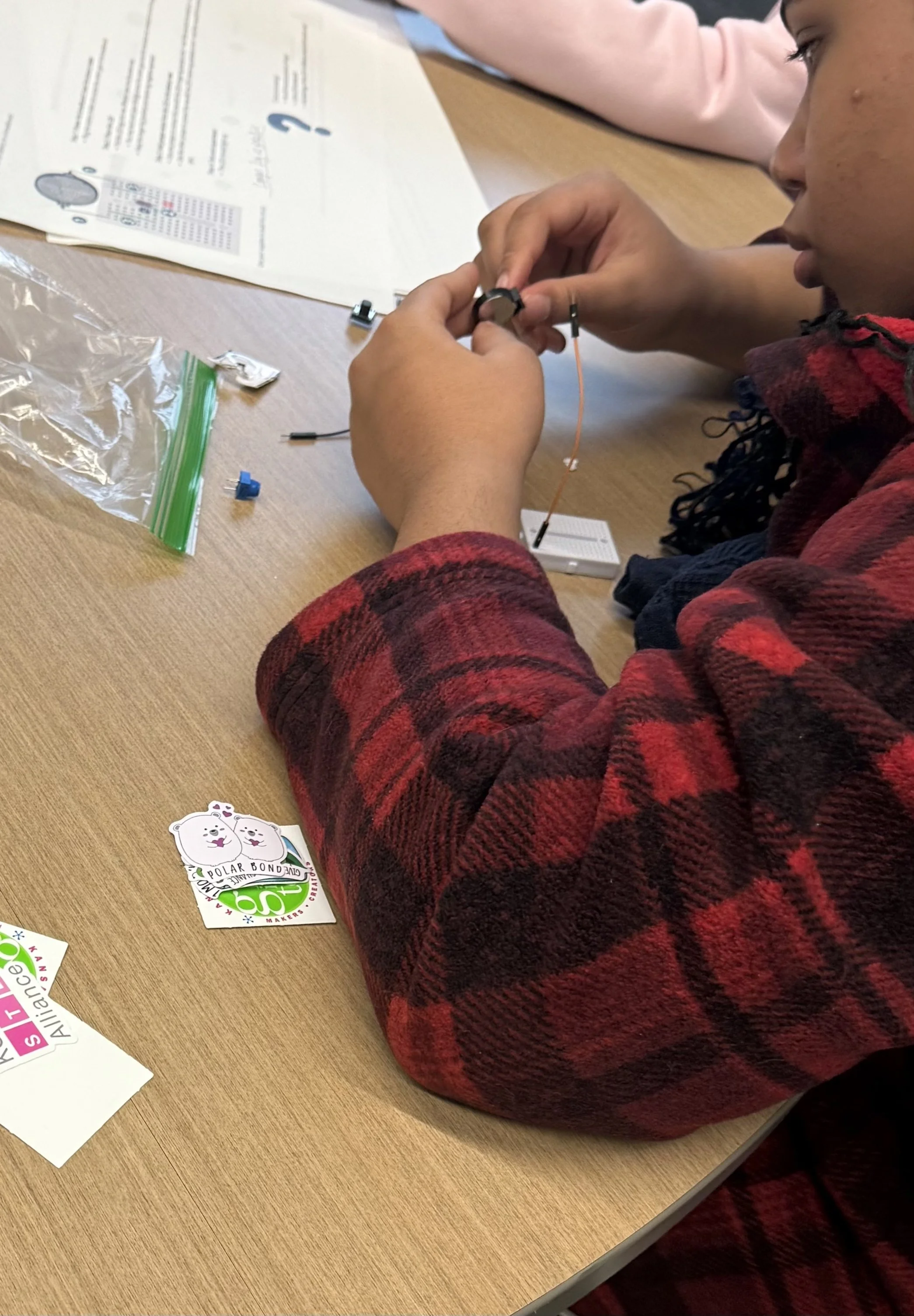 The look of someone discovering they actually love this kind of challenge. (Future engineer unlocked.)