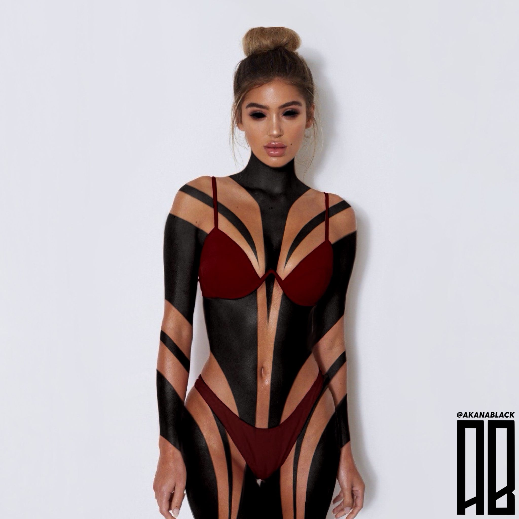 Woman with body paint resembling lingerie, standing against a white background, top bun hairstyle, makeup, and wearing maroon lingerie.