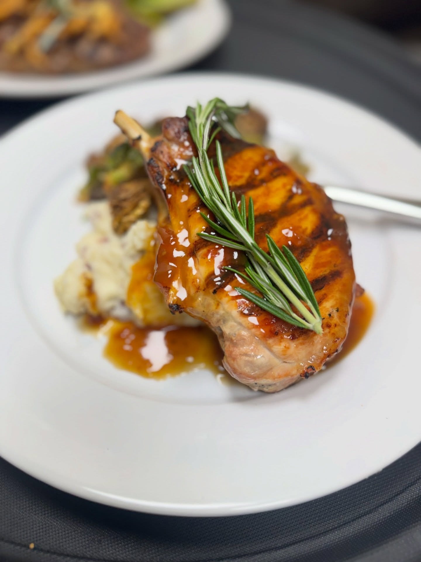One of our favorites - the center cut pork chop with bourbon glaze, garlic mashed potatoes, and Brussels. 🍽️

#SAVOURfarmville #savorthemoment #eatlocal #farmvillev #downtownfarmville