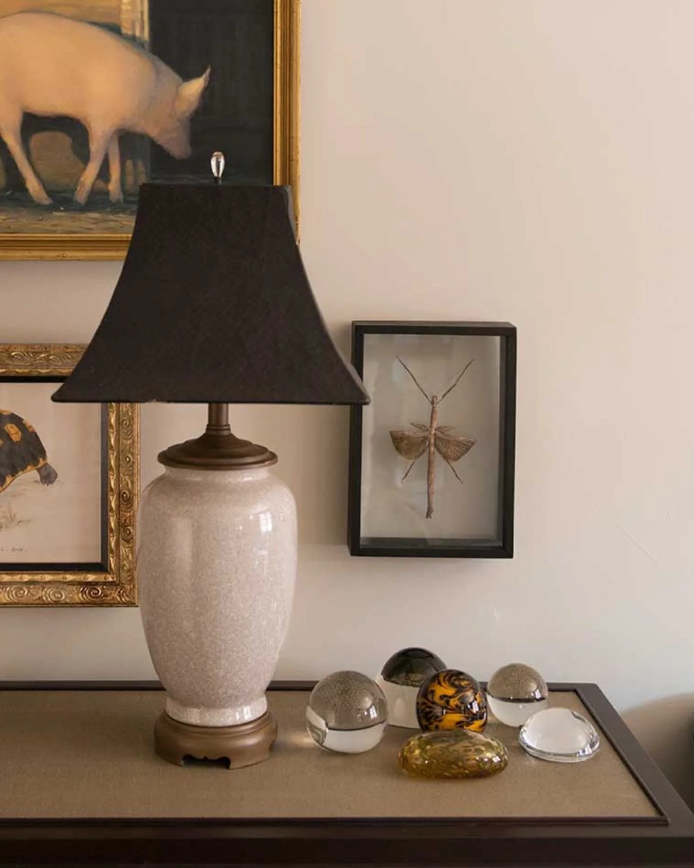 A quiet corner can still be a place for intentional design - curated art, soft light, and collected treasures all harmonizing together.

#interiordesign #interiordetails #interioraccessories