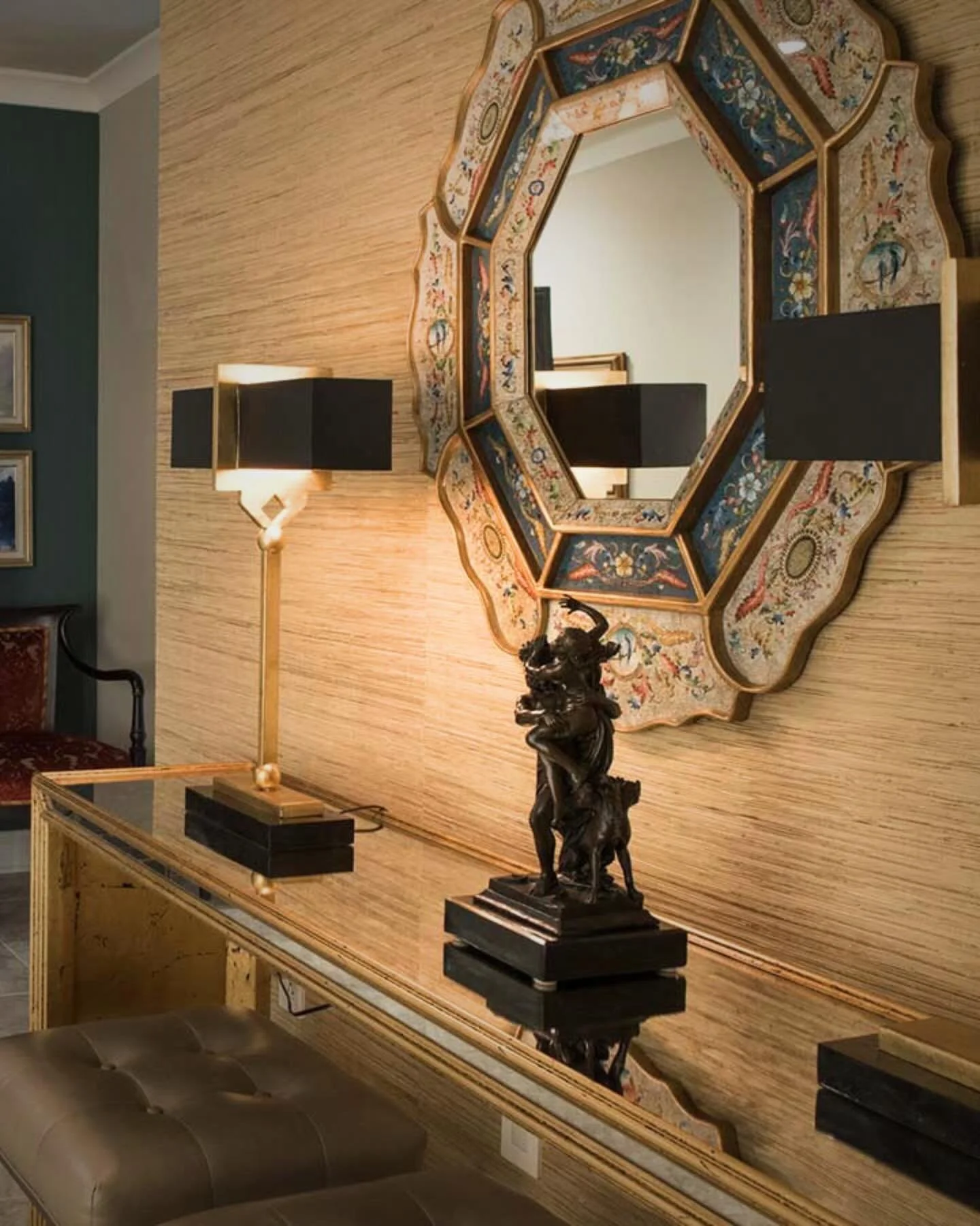 Sculptural black table lamps beautifully highlight the grasscloth wallcovering, complemented by meaningful pieces from the client&rsquo;s personal art collection and a hand-painted antique octagonal mirror.

#interiordesign #interiorstyling #davidlya