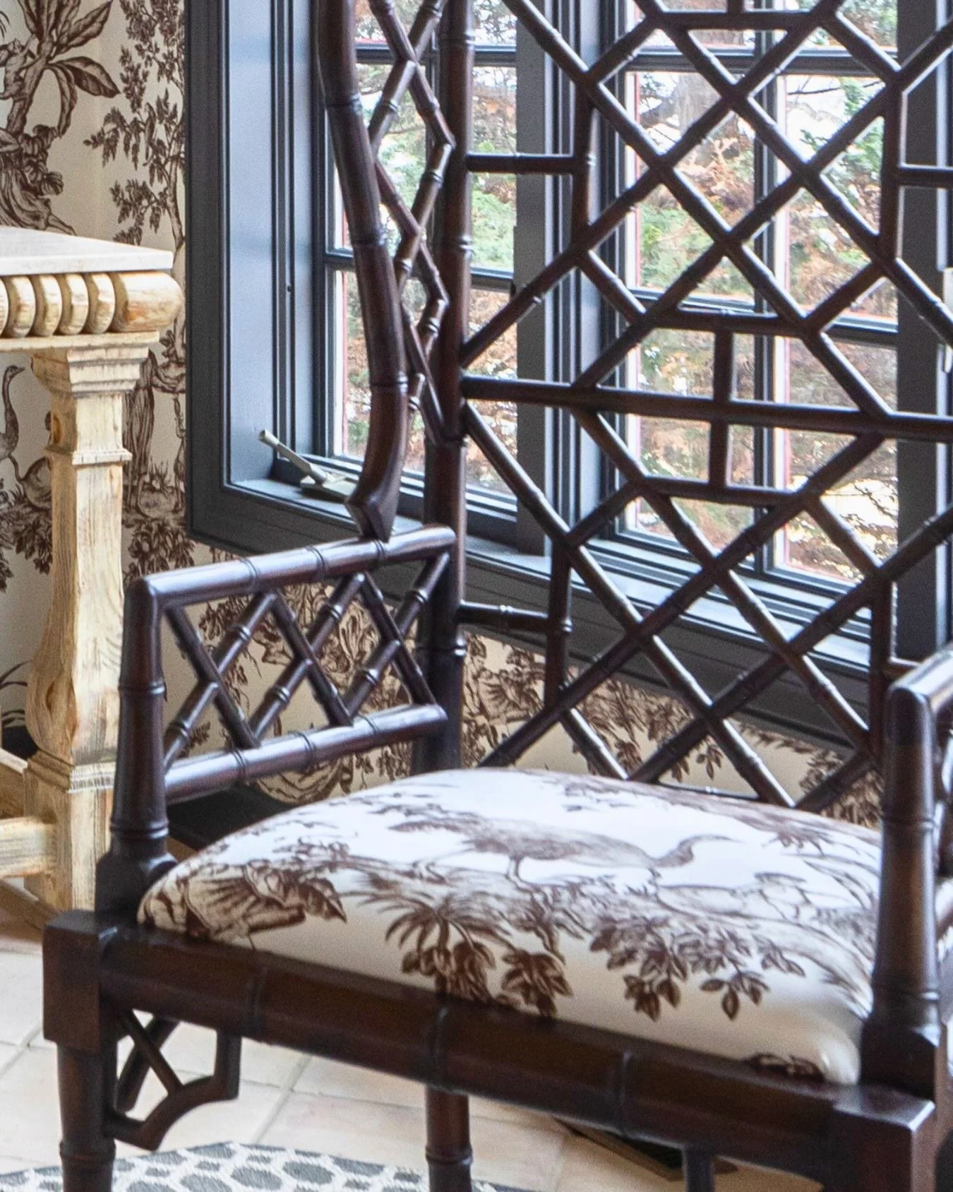 Design Tip: Repeating a pattern in a room is a great way to create rhythm and can even calm a &ldquo;busy&rdquo; pattern through repetition.

Here, a beautiful chinoiserie floral pattern is used on both the walls and the accent chair, creating flow i