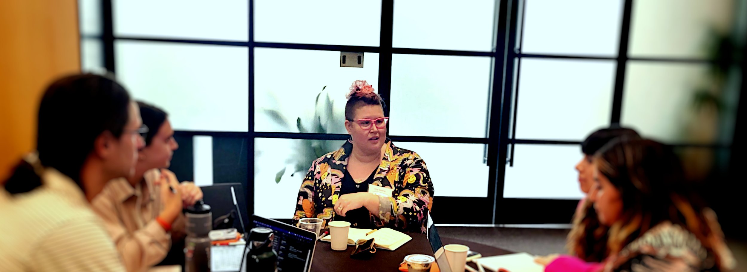 Ursa Scherer at conference talking and leading a group of people