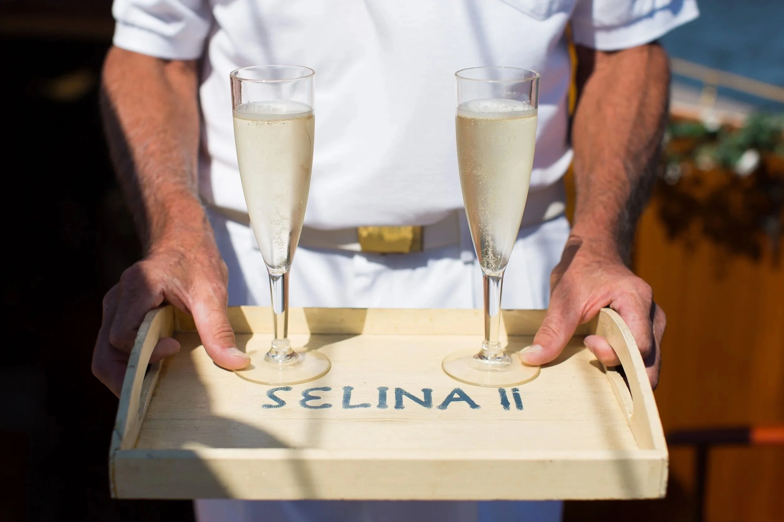Champagne glasses offered aboard your voyage on Sail Selina NY.