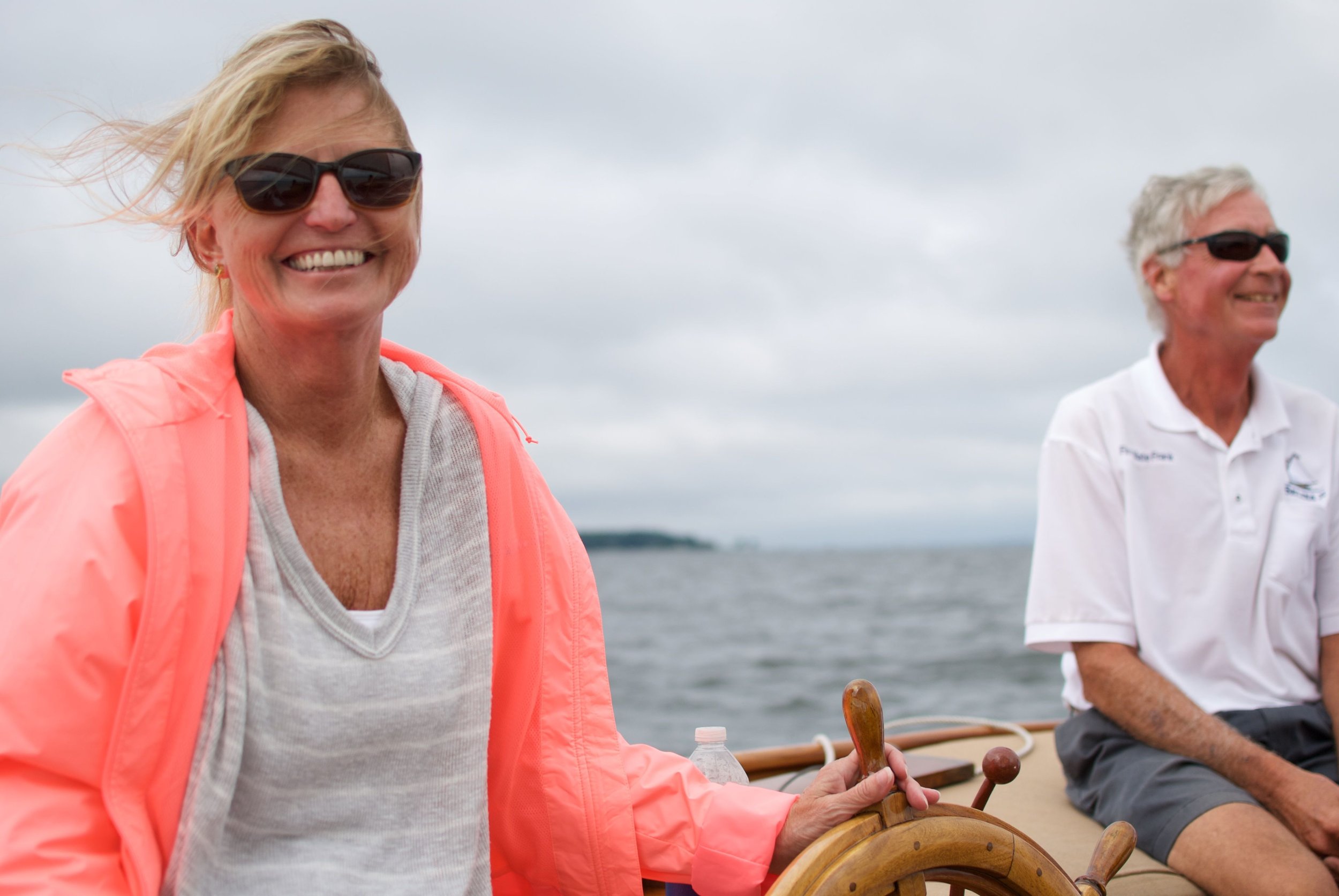 Guests enjoying a private sailing adventure on Sail Selina NY yacht in Shelter Island, NY, with views of the harbor and ocean.