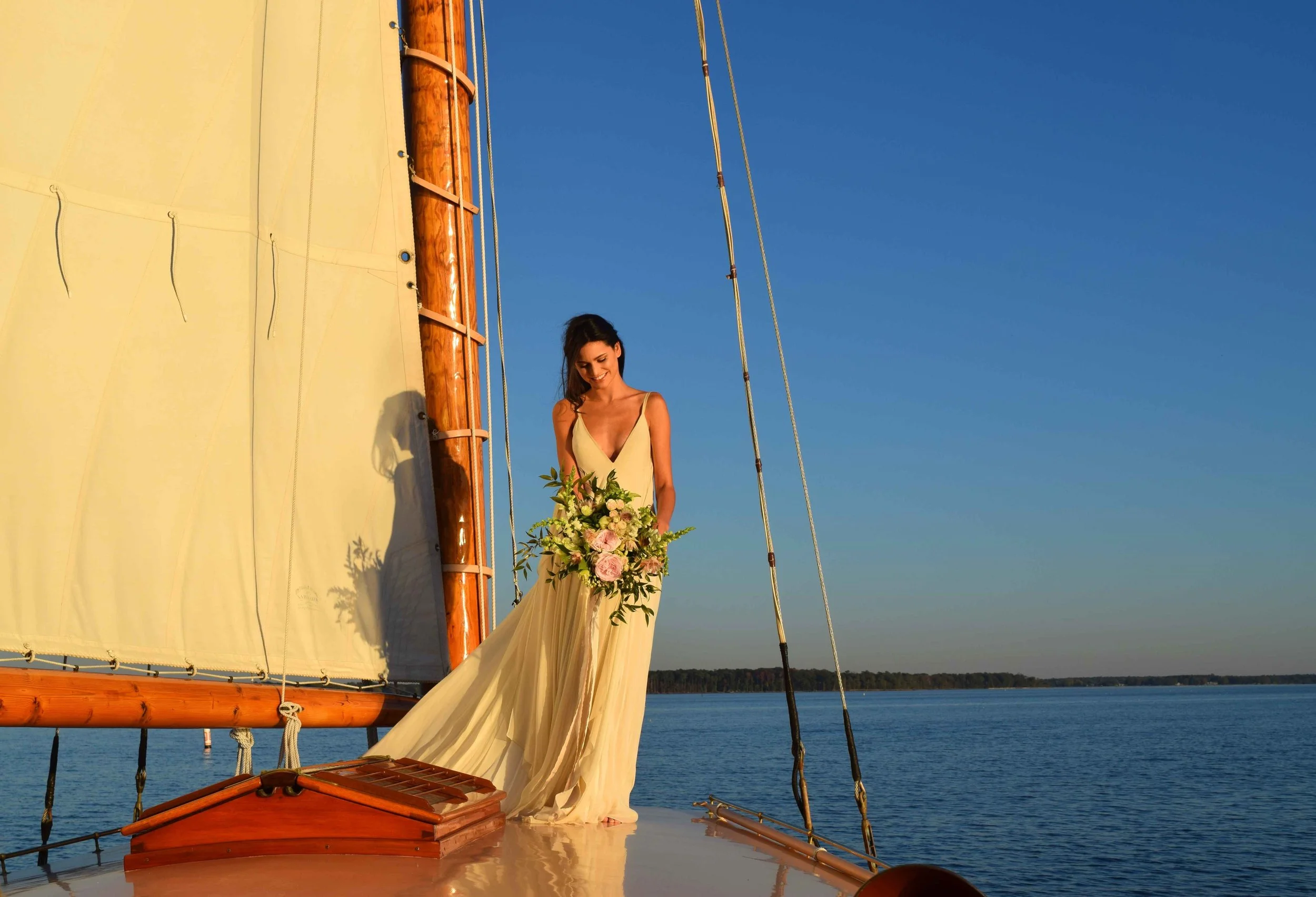 A stunning photo of a gorgeous bride on her wedding day aboard Selina II as a part of the Nautical Wedding Package.