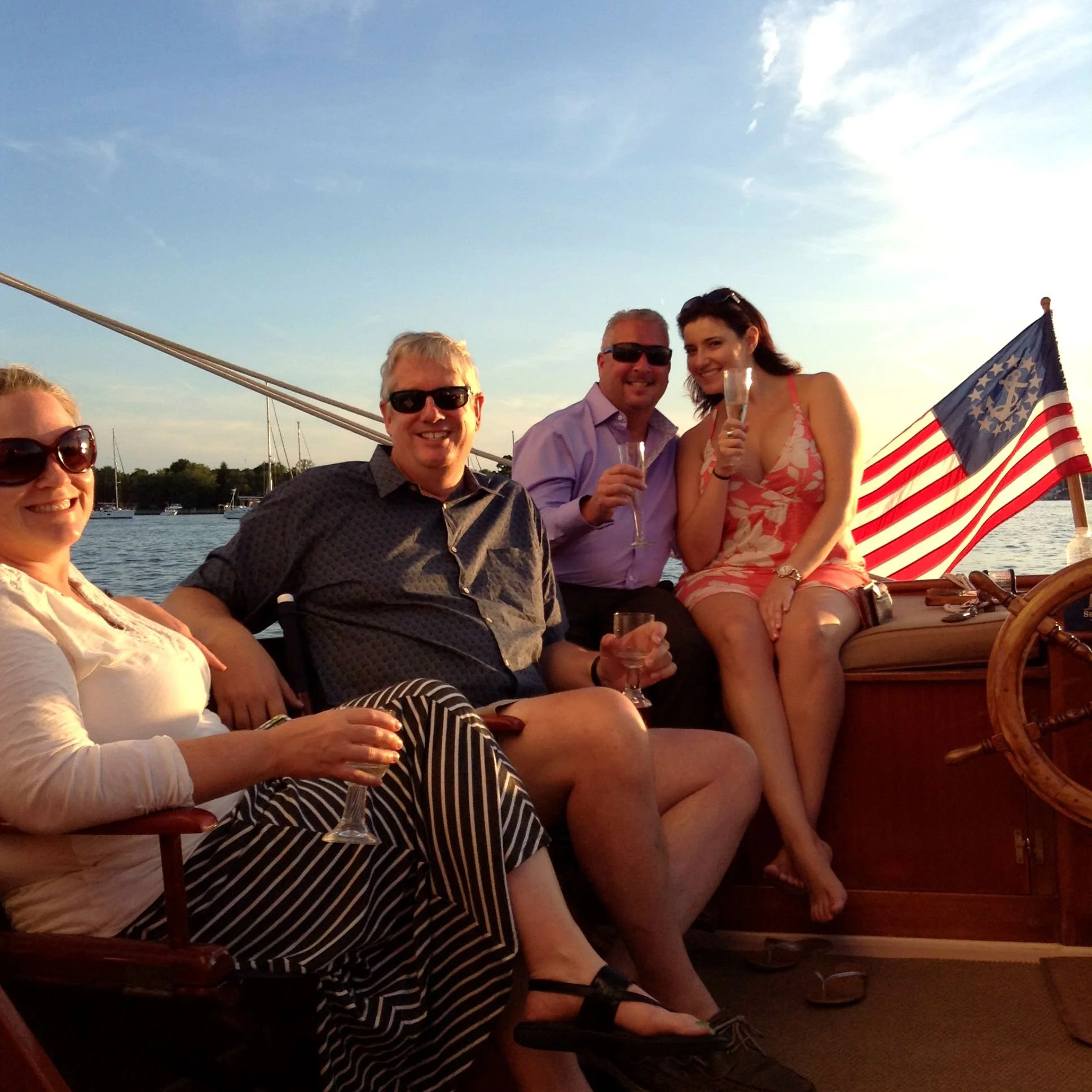 Two happy couples enjoying champagne aboard Selina II as part of the Romance Packages offered by Sail Selina NY.