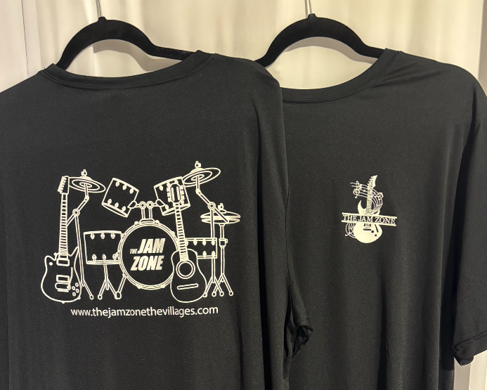 Black t-shirts with musical instrument and band logos hanging on black hangers.