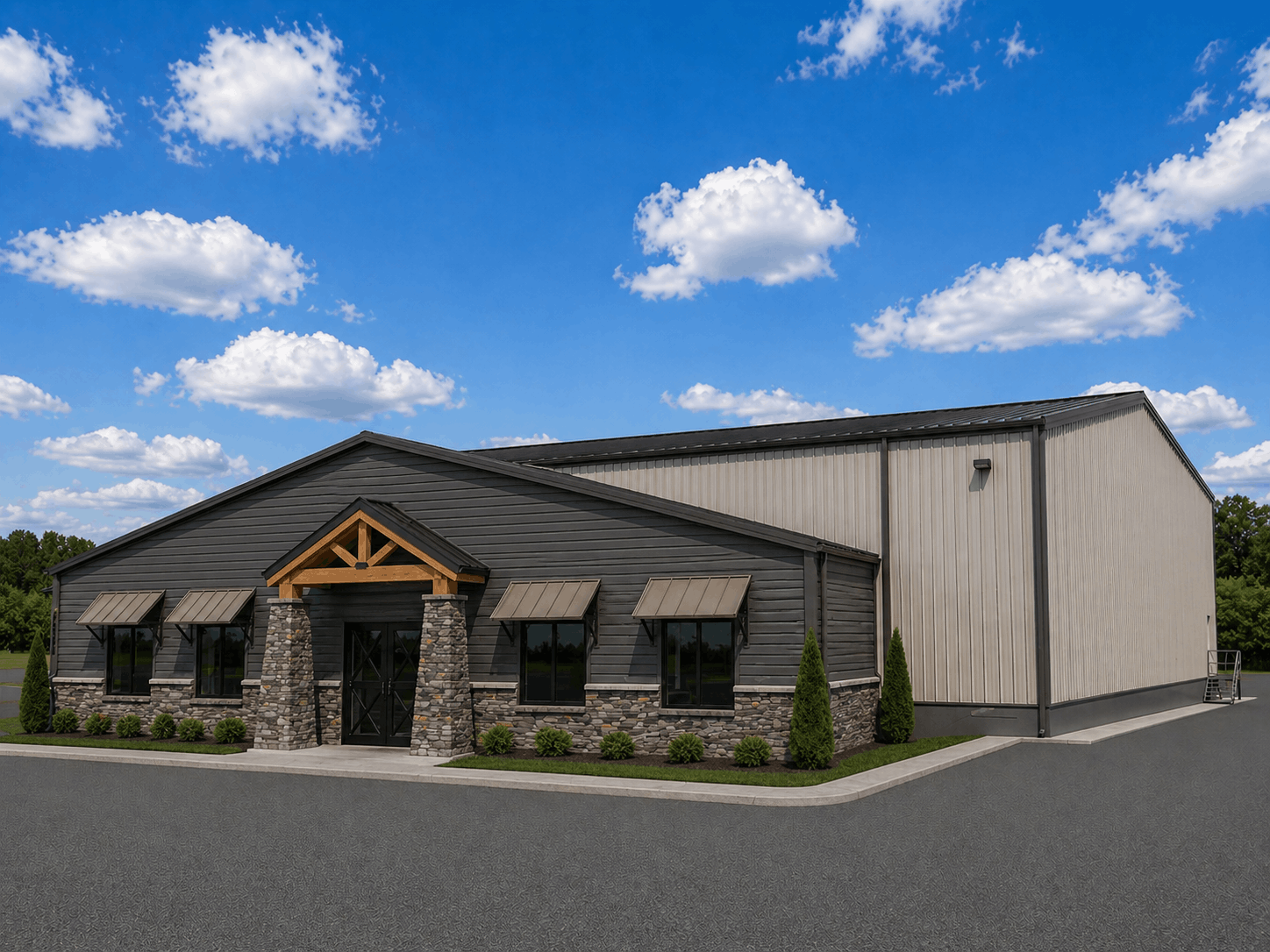 A modern commercial building with black wooden siding and gray stone accents, surrounded by neatly manicured bushes and a paved parking area, under a partly cloudy blue sky.
