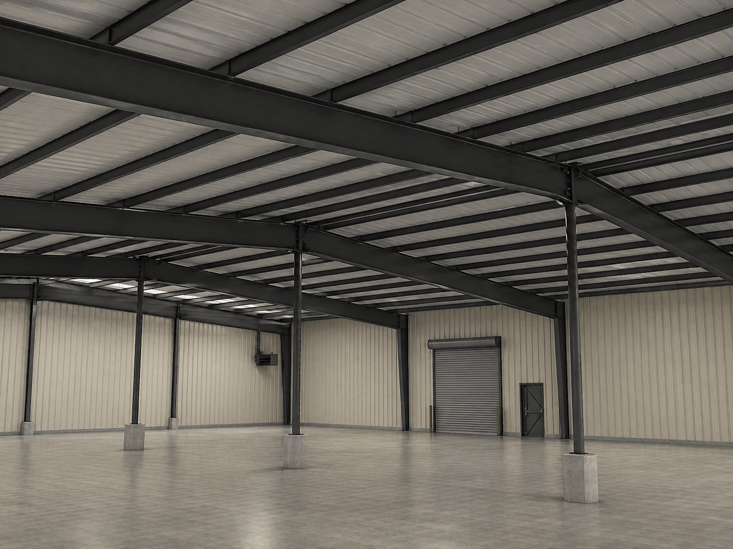 Open industrial warehouse interior with steel framing, high ceilings, and concrete floors.